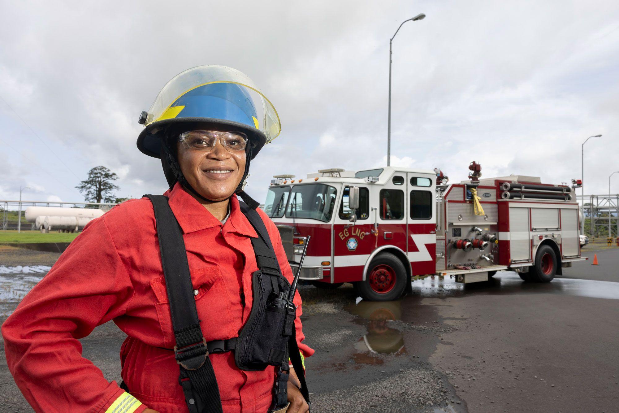 Worker in front of a firetruck